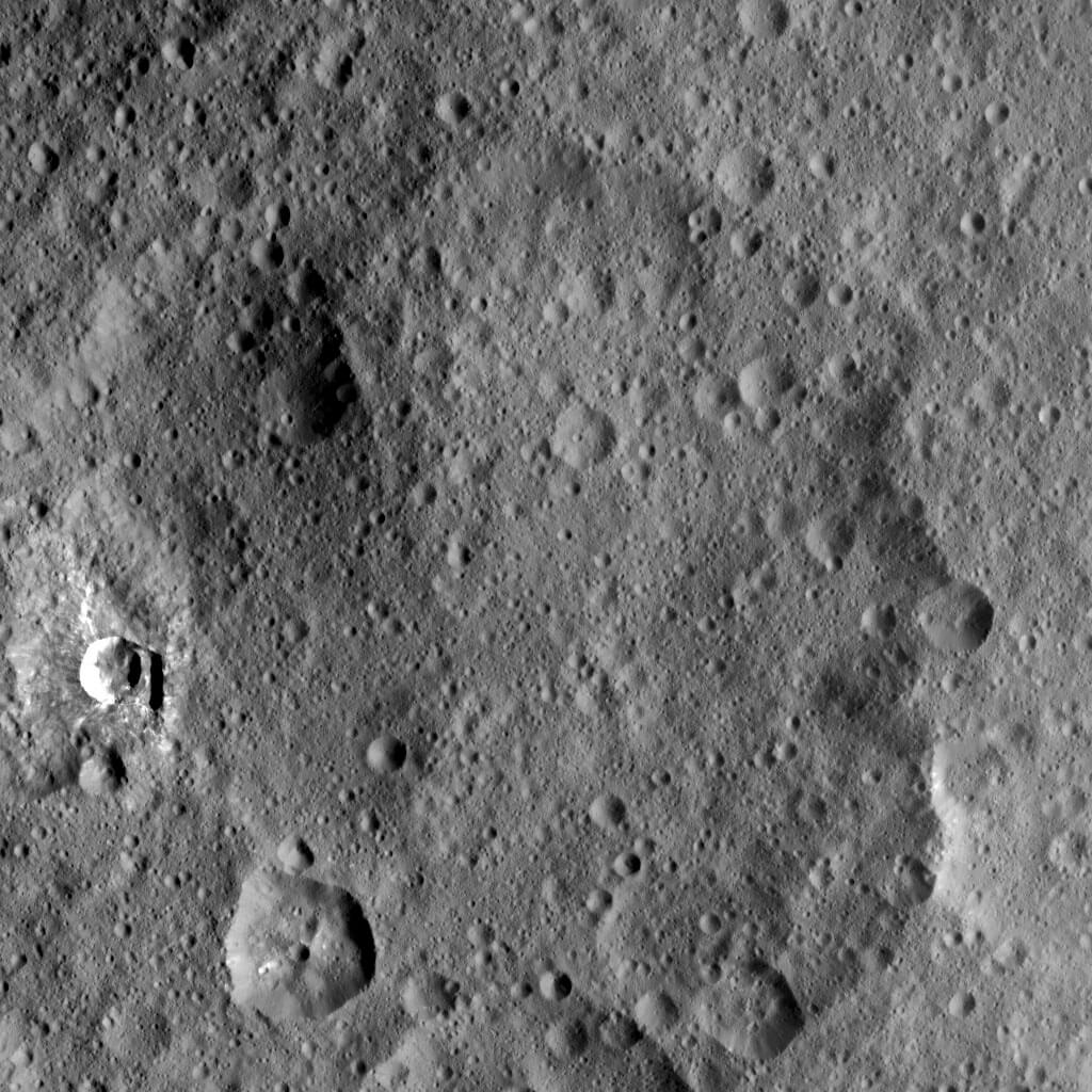 Image of the surface of the Moon covered with the remains of old and new impacts.