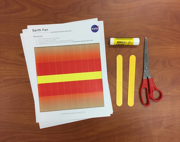 a photo of the supplies necessary for this activity: three printouts, jumbo popsicle sticks, scissors, and a glue stick