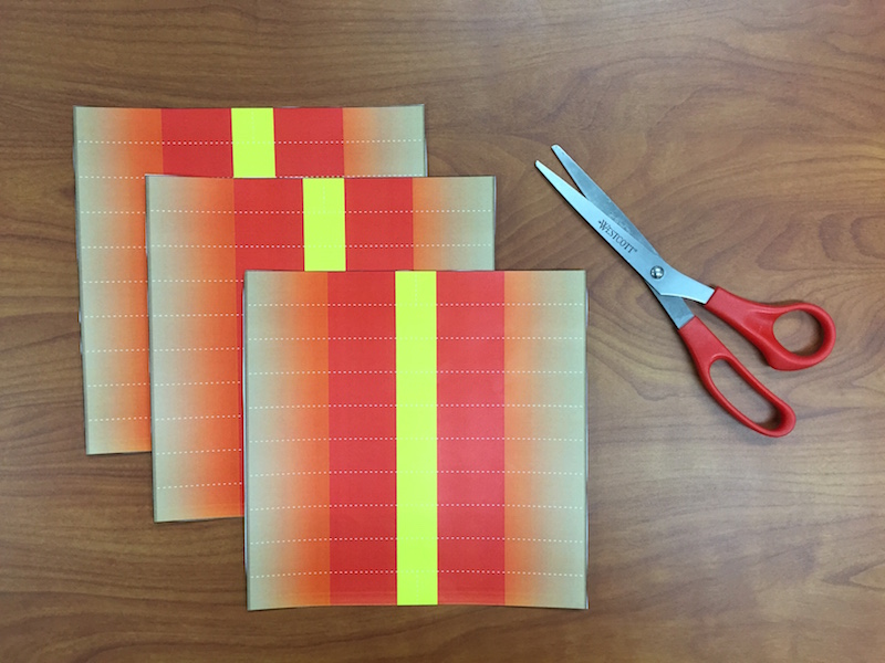 a photo of the 3 shapes cut out next to scissors on a table