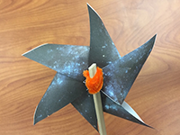 photo of a paper pinwheel galaxy