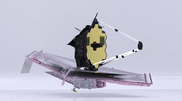 The James Webb Space Telescope rotates so that the user can see all parts of the telescope. The top portion is a mirror made up of shiny golden hexagons and the bottom part is a shiny silver sunshade that looks like a giant foil diamond under the telescope.