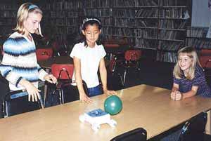 Girls admire their balloon-powered nanorover.