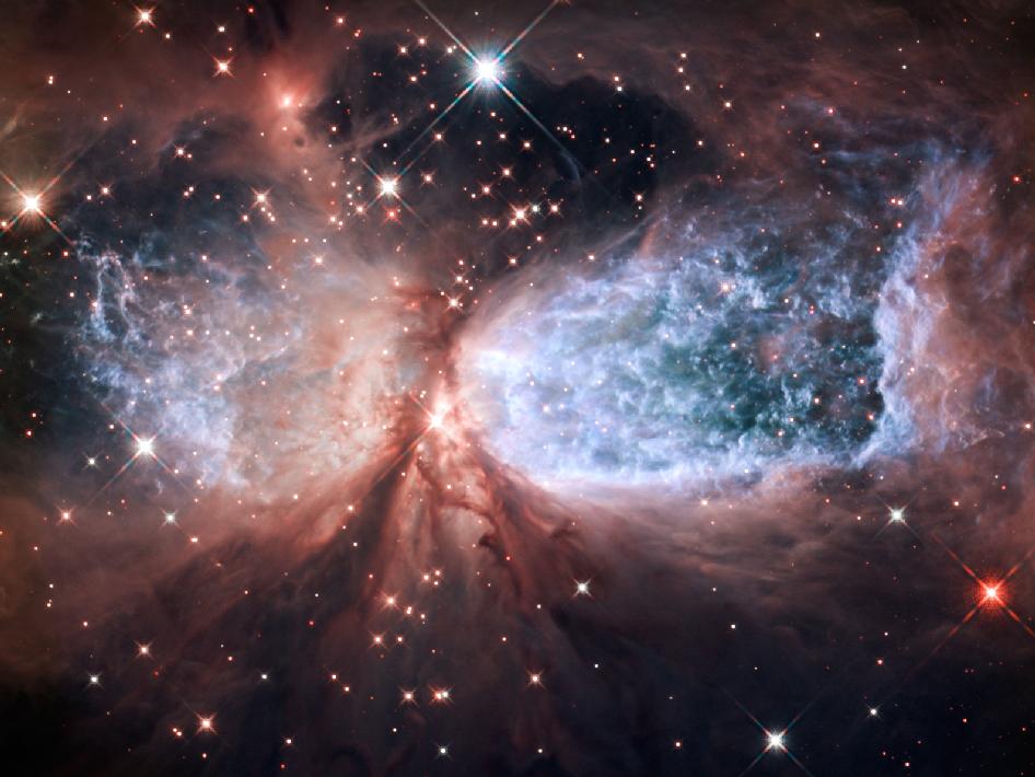 image of nebulous cloud which many stars surrounding it.