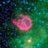 Pink cloud: Remains of a supernova, when a massive star exploded, blasting waves of hot gas into space. This image combines X-rays and infrared light.