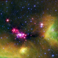 Pink spots: The bright pinks dots are baby (girl?) stars in the Serpens star-forming region. Each young star is surrounded by a disk of gas and dust that could someday form into planets.